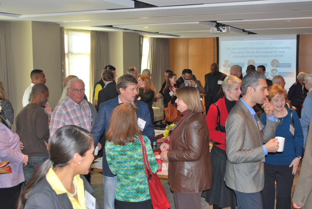 Clients, supporters, and staff mingle during the event